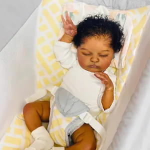 Realistic 19-inch dark skin reborn baby doll Laura in white romper and crib