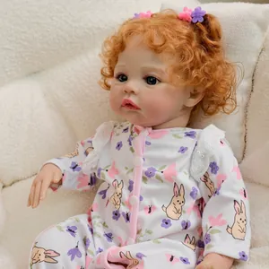 Realistic 19-inch reborn doll with curly orange hair and floral rabbit print romper