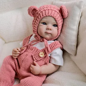 19-inch lifelike reborn baby doll in pink hand-knitted overalls and bear-eared hat