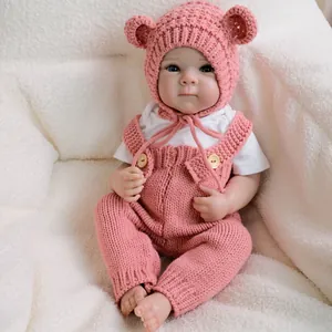 19-inch realistic reborn baby doll Bettie in pink knitted overalls and bear ear hat