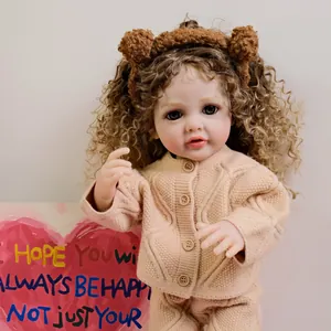 Lifelike 22-inch reborn baby doll in beige knit sweater and cute bear ear headband