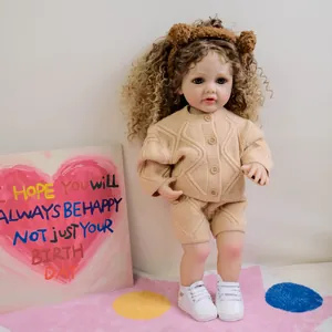 Lifelike 22-inch reborn baby doll in beige knit sweater and bear ear headband