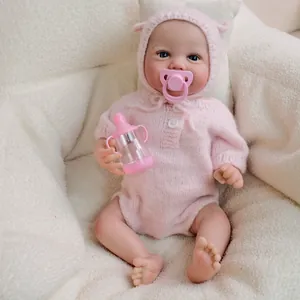 19-inch handmade reborn baby doll in pink knitted romper and hat with pacifier and bottle
