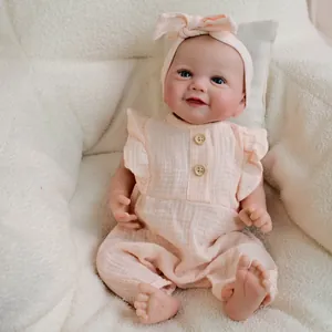 Realistic 19 inch Reborn Baby Doll Emmy in peach muslin romper with wooden buttons