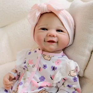 19-inch realistic reborn baby doll in butterfly floral jumpsuit with pink headband