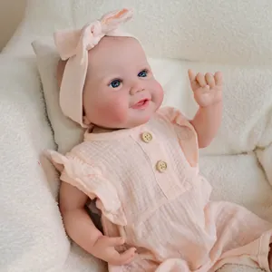 19 inch lifelike reborn baby girl doll in pink ruffled romper with matching headband