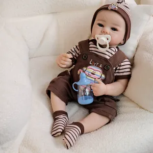 Handmade 19-inch reborn baby doll in monkey corduroy overalls with bottle and pacifier