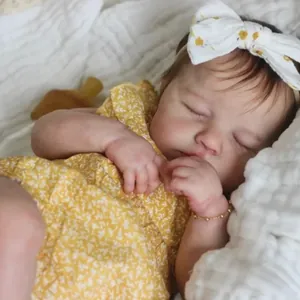 19-inch sleeping reborn baby doll in yellow floral outfit with matching headband