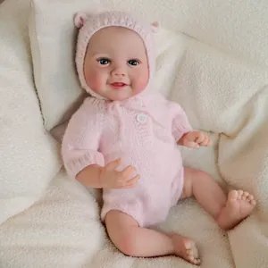 Realistic 19-inch reborn baby doll in pink knitted jumpsuit and bear ear hat