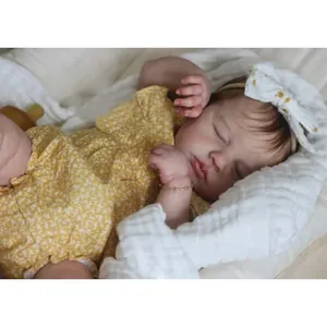 19-inch lifelike reborn baby doll in yellow floral romper with large white bow headband