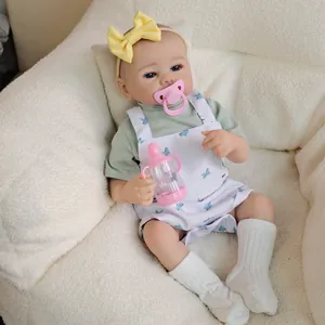 19-inch lifelike reborn baby doll Julietta in mint t-shirt and bird print overalls