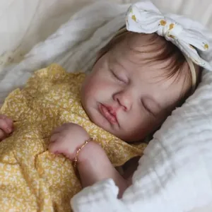 19 inch lifelike sleeping reborn baby doll in yellow floral ruffle outfit and headband