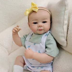 Lifelike 19 inch reborn baby doll Julietta in mint green outfit and rabbit overalls