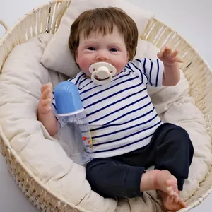 19-inch realistic reborn doll in blue striped outfit with pacifier and feeding bottle