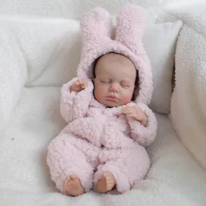 Poupée réaliste de 12 pouces portant une grenouillère en peluche lapin rose en train de dormir