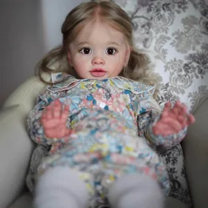 Lifelike 26-inch reborn baby doll with long blonde hair in a floral long-sleeved dress
