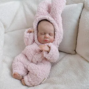 Poupée reborn réaliste de 12 pouces en combinaison en peluche rose avec oreilles de lapin
