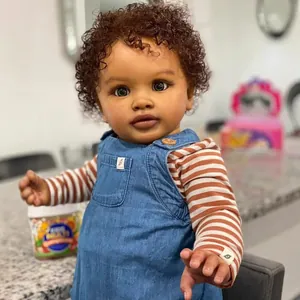 Realistic 26-inch Pippa reborn doll with brown curls in denim overalls and striped shirt