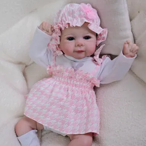 Realistic 19-inch reborn baby doll Julietta in pink plaid lace outfit and floral hat