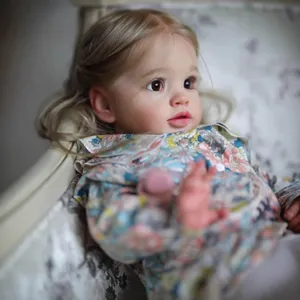 26-inch lifelike reborn baby doll with floral shirt, blonde hair, and brown eyes for kids