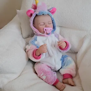 Realistic 19-inch Charlotte reborn baby doll wearing a colorful unicorn hooded romper