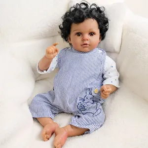20-inch realistic reborn baby doll with deep skin tone, curly hair, and striped overalls