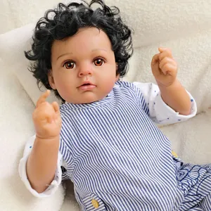 20 inch lifelike reborn baby boy doll with dark skin and curly hair on white fur