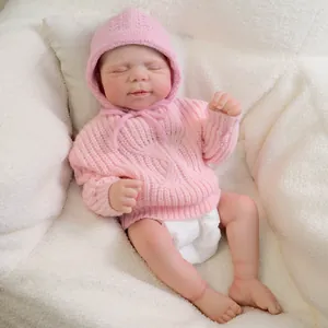Realistic 19-inch reborn baby doll in pink knitted sweater and hat sleeping peacefully