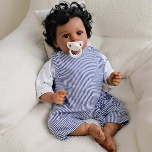 20 inch deep skin reborn boy doll with curly hair in blue striped overalls and pacifier