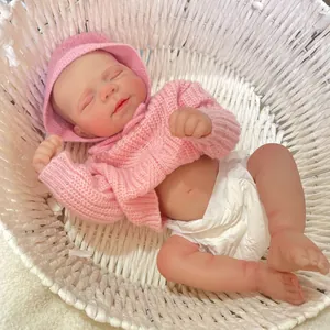 19 inch lifelike reborn baby doll in pink knit sweater and hat in white cradle