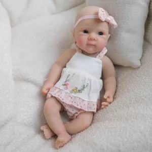 8 inch pink lace outfit realistic silicone baby doll with blue eyes on white plush blanket