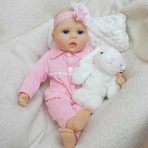 Poupée bébé reborn de 16 pouces en tenue rose avec lapin en peluche et bandeau floral