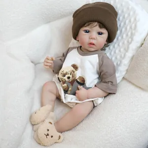 Realistic 19-inch reborn baby doll with curly hair, wearing a cute bear outfit