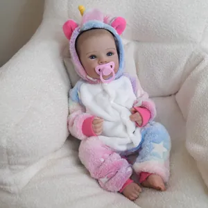 Lifelike 18 inch reborn baby doll in a pink unicorn plush onesie with blue eyes and pacifier