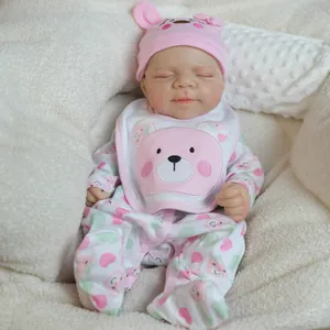 Realistic 18-inch sleeping silicone reborn baby doll in pink bear outfit and hat