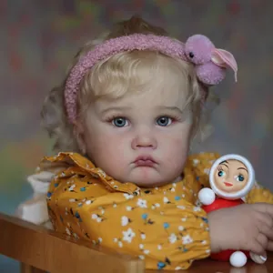 Realistic 24-inch reborn toddler girl doll with curly blonde hair and floral dress