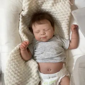 19-inch lifelike reborn baby doll sleeping in striped shirt on a soft knitted blanket