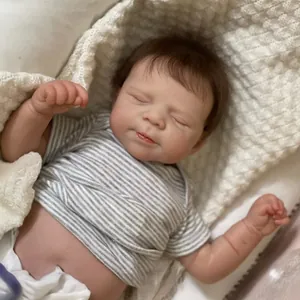 Realistic 19-inch sleeping reborn baby doll in grey striped short sleeve romper