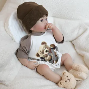 19-inch realistic reborn baby doll in gray bear outfit with knitted hat and plush socks