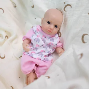 8-inch realistic silicone baby doll wearing a pink elephant print outfit on soft fabric