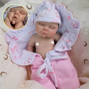 Lifelike 12-inch soft solid silicone sleeping baby doll with pink patterned swaddle