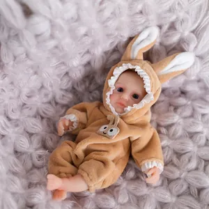 Lifelike 15cm mini silicone reborn baby doll wearing a brown plush bunny outfit