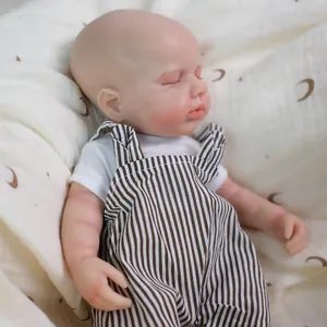 12-inch realistic solid silicone reborn baby doll in striped overalls on a moon blanket