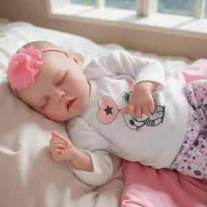 16-inch sleeping newborn reborn baby girl doll in white top and floral pants