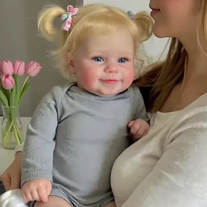 Realistic 20-inch Reborn Maddie doll with blonde hair in grey long-sleeved romper