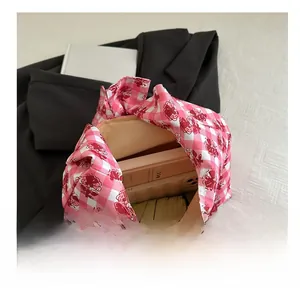 Detail view of the large capacity interior of the pink checkered tote bag for daily essentials