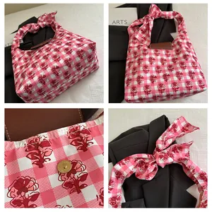 Detail shots of tote bag featuring pink floral plaid fabric and bow-shaped shoulder strap