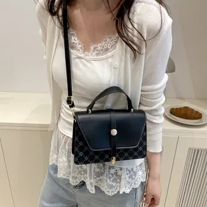 Vintage retro crossbody bag for women with black leather and blue geometric patterns