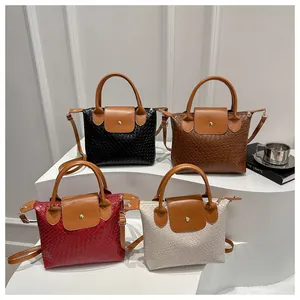 Detailed display of four woven PU leather handbags in black, brown, red, and off-white