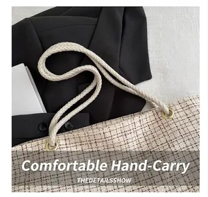 Close-up of woven tote bag showing red-brown checkered texture and cotton rope handles
